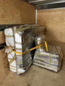 Protected mattress securely loaded into a moving truck by Ottawa Next Movers