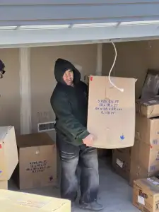 Professional movers transporting belongings from storage to a home