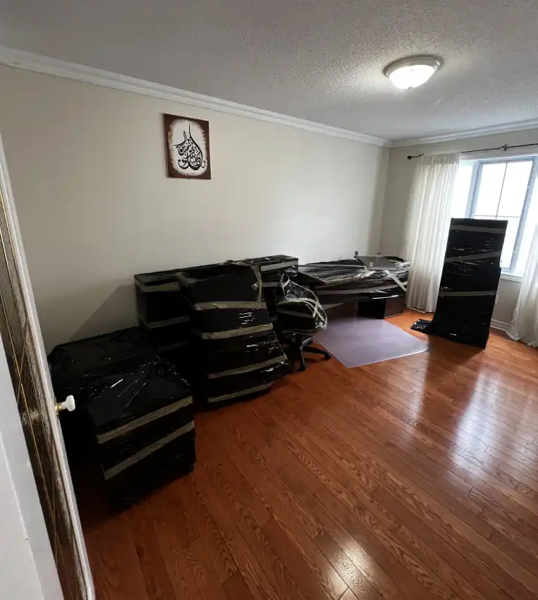 What's Included in Ottawa Next Movers Condo Moving Service Ottawa Next Movers movers carefully moving furniture through a condo building