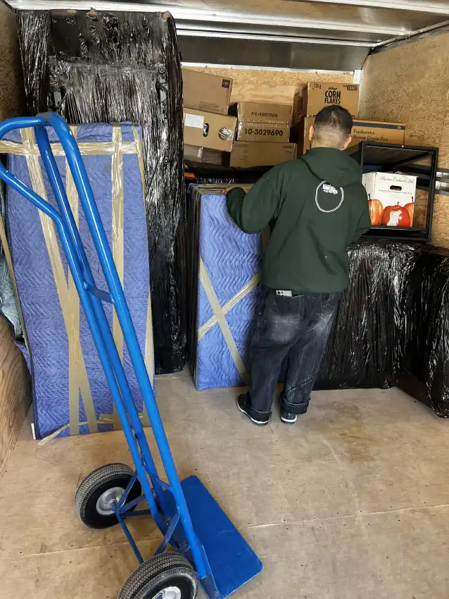Ottawa Next Movers movers carefully wrapping and moving furniture during a relocation