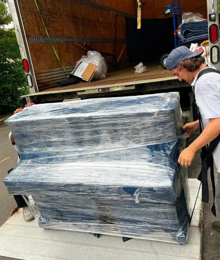 Ottawa Next Movers movers carefully moving and protecting a piano during relocation